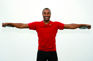 Colin Jackson demonstrates a Lat Raise